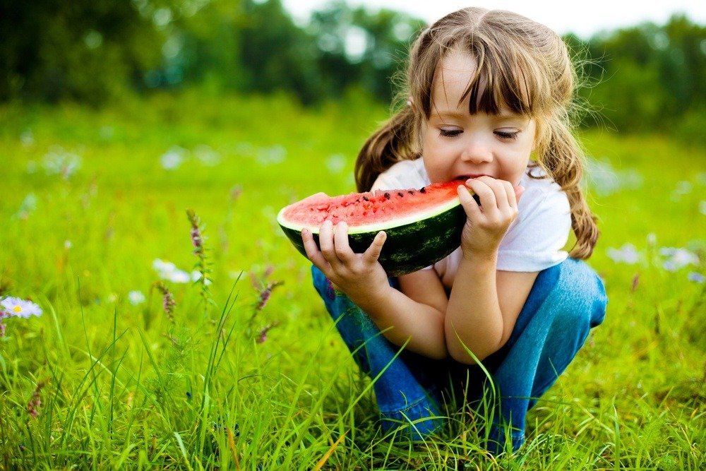 Kid eating watermelon